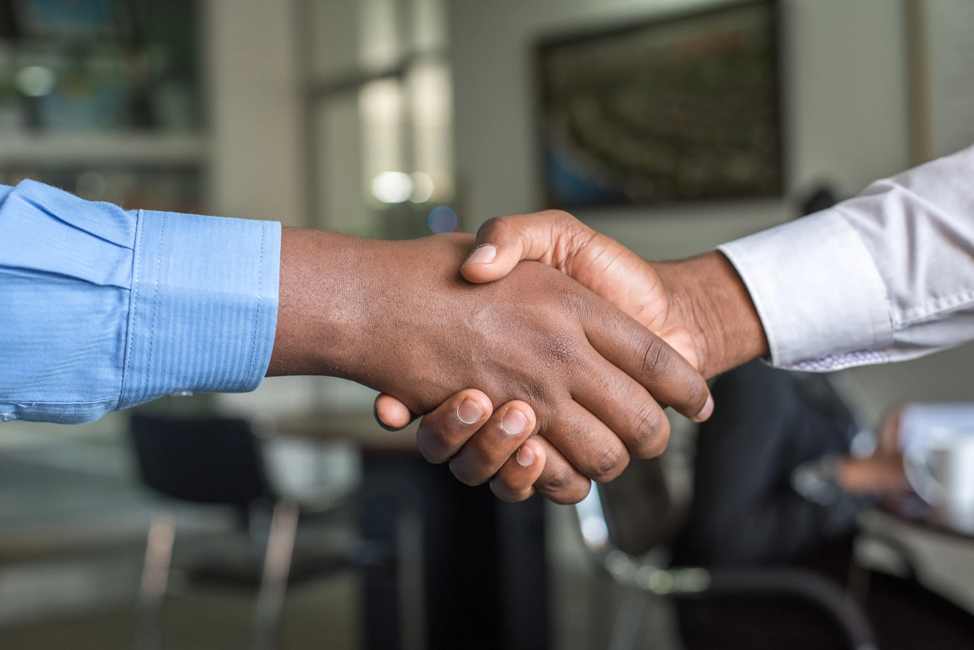 Handshake after agreeing a business consulting engagement