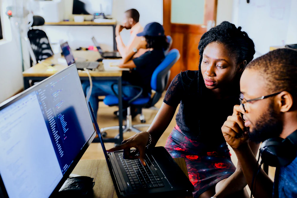 Marketing team reviewing a campaign on screen