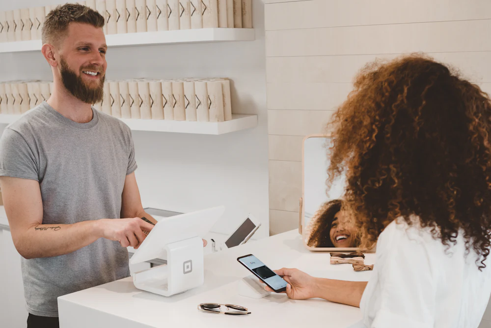 Small business owner accepting a card payment for an online order